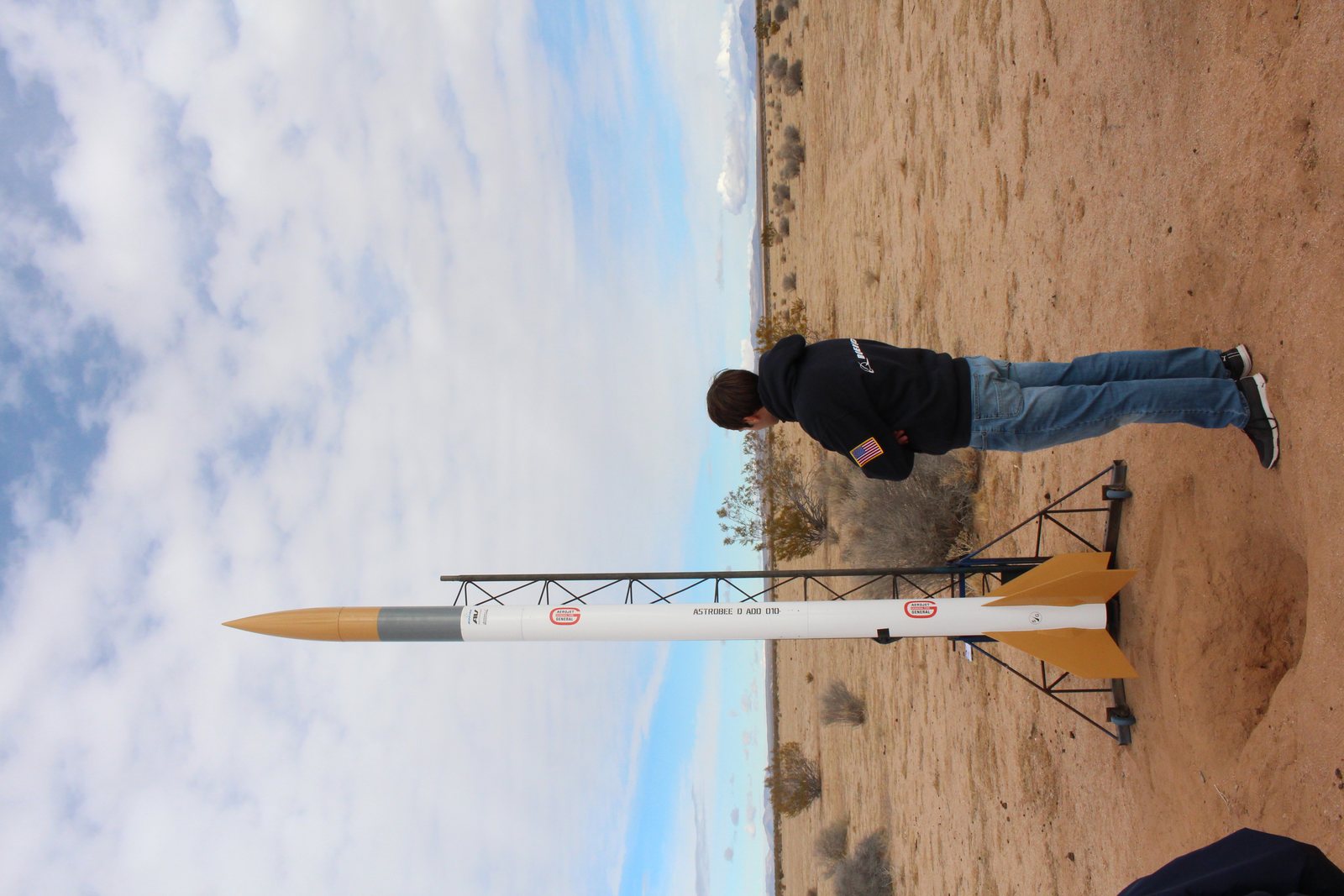 Forest Siewert standing near a research rocket